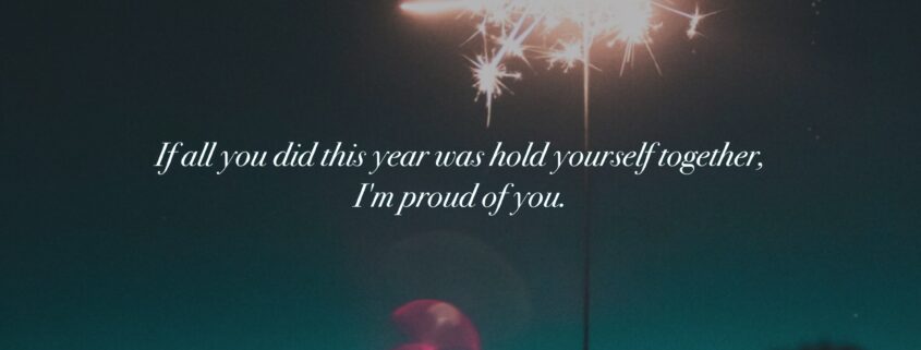 Hand holding sparkler. Text says if all you did this year was hold yourself together, I’m proud of you.